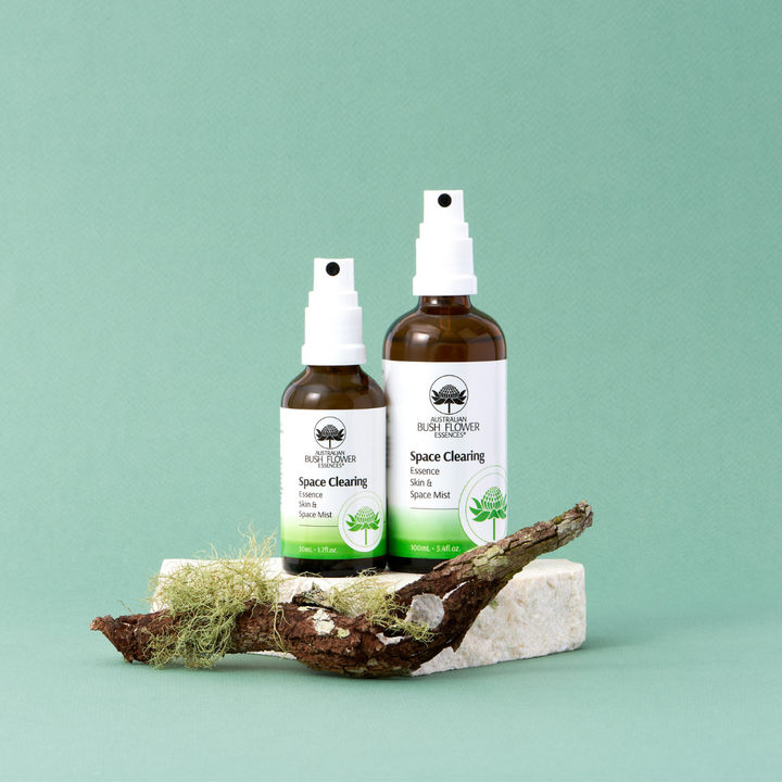 Two bottles of Australian Bush Flower Essences 'Space Clearing' Space Mist on a light green background